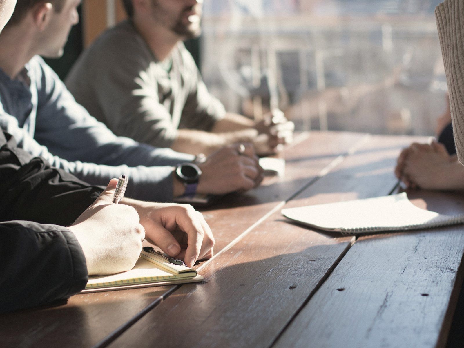 A leadership team working through papers around a table